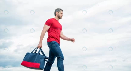 active man walking with sporty bag sky background rnd540 frp30628931 - title:graphic home - اورچین فایل - format: - sku: - keywords: p_id:353984