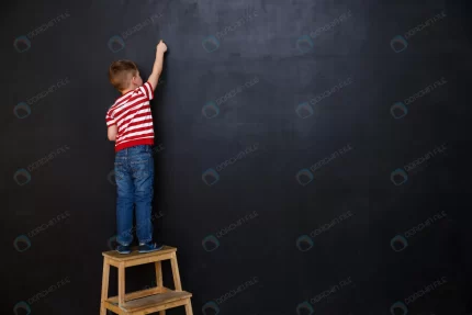 back view cute little kid boy writing with chalk crceb0779e4 size10.73mb 5760x3840 1 - title:graphic home - اورچین فایل - format: - sku: - keywords: p_id:353984