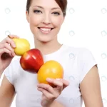 - beauty young laughing woman holding some fruits crce060b362 size3.26mb 2832x4256 1 - Home