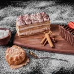 chocolate cake slice with tiramisu wooden platter crc0196b492 size23.55mb 6240x4160 - title:Home - اورچین فایل - format: - sku: - keywords:وکتور,موکاپ,افکت متنی,پروژه افترافکت p_id:63922