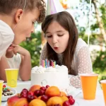 - close up friends blowing out candles rnd677 frp16614139 - Home