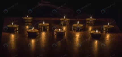 closeup shot burning candles wooden table crc2d953722 size12.25mb 5472x2573 - title:graphic home - اورچین فایل - format: - sku: - keywords: p_id:353984
