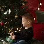 cute little kid unpacking christmas gift box bed crc022dea92 size13.42mb 3840x5760 1 - title:Home - اورچین فایل - format: - sku: - keywords:وکتور,موکاپ,افکت متنی,پروژه افترافکت p_id:63922