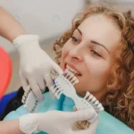 dentist comparing patient s teeth shade with samp crcf567eef3 size8.81mb 5275x3517 - title:Home - اورچین فایل - format: - sku: - keywords:وکتور,موکاپ,افکت متنی,پروژه افترافکت p_id:63922