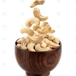 falling cashew nuts into wooden bowl isolated whi crc895efdab size5.15mb 3856x4585 - title:Home - اورچین فایل - format: - sku: - keywords:وکتور,موکاپ,افکت متنی,پروژه افترافکت p_id:63922