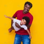 father afro son yellow background smiling playing crc8bcfeb79 size6.25mb 5472x3648 1 - title:Home - اورچین فایل - format: - sku: - keywords:وکتور,موکاپ,افکت متنی,پروژه افترافکت p_id:63922