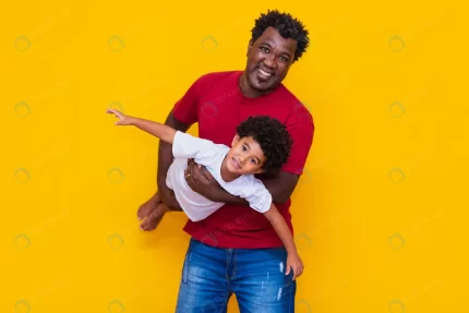father afro son yellow background smiling playing crc8bcfeb79 size6.25mb 5472x3648 1 - title:graphic home - اورچین فایل - format: - sku: - keywords: p_id:353984