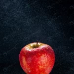 front view fresh red apple black background color crc980aa648 size8.77mb 3733x5600 - title:Home - اورچین فایل - format: - sku: - keywords:وکتور,موکاپ,افکت متنی,پروژه افترافکت p_id:63922