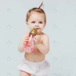 happy girl diaper with cute hairstyle holds bottl crc901905b2 size5.93mb 6235x4157 - title:Home - اورچین فایل - format: - sku: - keywords:وکتور,موکاپ,افکت متنی,پروژه افترافکت p_id:63922