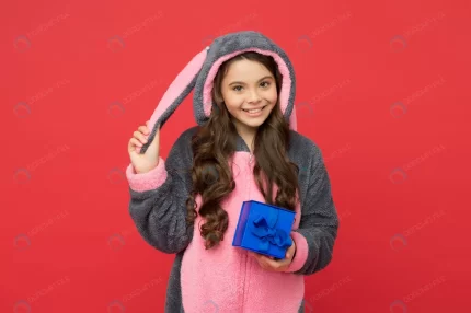 happy kid wear rabbit kigurumi pajamas holding gi crccca843c9 size6.91mb 4928x3280 - title:graphic home - اورچین فایل - format: - sku: - keywords: p_id:353984