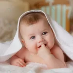 happy smiling baby towel after bathing crcd78e0fc7 size8.27mb 5244x3495 - title:Home - اورچین فایل - format: - sku: - keywords:وکتور,موکاپ,افکت متنی,پروژه افترافکت p_id:63922
