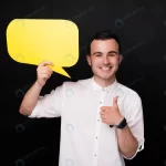 happy young man showing thumb up holding yellow s crcb9fb016c size6.74mb 6016x4016 - title:Home - اورچین فایل - format: - sku: - keywords:وکتور,موکاپ,افکت متنی,پروژه افترافکت p_id:63922