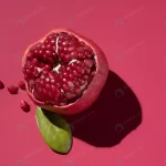 juicy cut pomegranate red background with hard sh crca850b60a size3.48mb 4974x3328 - title:Home - اورچین فایل - format: - sku: - keywords:وکتور,موکاپ,افکت متنی,پروژه افترافکت p_id:63922