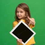little funny girl with tablet green studio wall crcdb488cdf size11.92mb 5760x3840 - title:Home - اورچین فایل - format: - sku: - keywords:وکتور,موکاپ,افکت متنی,پروژه افترافکت p_id:63922