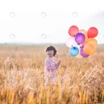 little girl playing with balloons wheat field crc840de2e2 size7.46mb 5472x3648 - title:Home - اورچین فایل - format: - sku: - keywords:وکتور,موکاپ,افکت متنی,پروژه افترافکت p_id:63922