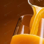 - orange juice pouring into glass crc72d49ccd size7.52mb 4000x2667 1 - Home