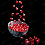 pomegranate seeds falling into bolw crcff0697be size3.44mb 4000x6000 - title:Home - اورچین فایل - format: - sku: - keywords:وکتور,موکاپ,افکت متنی,پروژه افترافکت p_id:63922