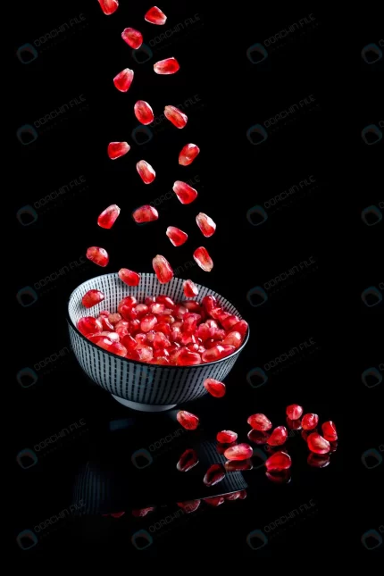 pomegranate seeds falling into bolw crcff0697be size3.44mb 4000x6000 - title:graphic home - اورچین فایل - format: - sku: - keywords: p_id:353984