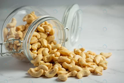 raw cashews nuts open glass jar marble background crc943ebdd2 size8.11mb 5760x3840 - title:graphic home - اورچین فایل - format: - sku: - keywords: p_id:353984