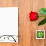 red roses wooden table notepad - title:Home - اورچین فایل - format: - sku: - keywords:وکتور,موکاپ,افکت متنی,پروژه افترافکت p_id:63922