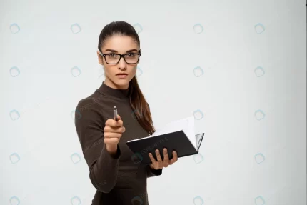 serious businesswoman pointing you hold notebook crca0540e6f size0.12mb 1920x1281 - title:graphic home - اورچین فایل - format: - sku: - keywords: p_id:353984