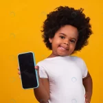 small afro child girl holding phone pointing isola rnd684 frp20878648 - title:Home - اورچین فایل - format: - sku: - keywords:وکتور,موکاپ,افکت متنی,پروژه افترافکت p_id:63922