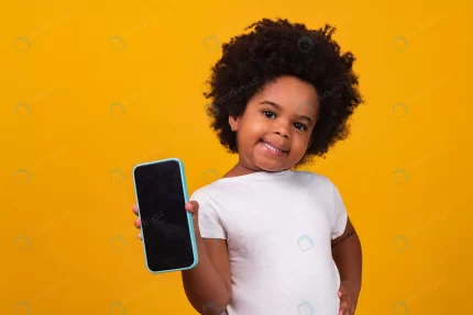 small afro child girl holding phone pointing isola rnd684 frp20878648 - title:graphic home - اورچین فایل - format: - sku: - keywords: p_id:353984