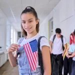 student teenager girl with usa flag inside school rnd684 frp28360100 - title:Home - اورچین فایل - format: - sku: - keywords:وکتور,موکاپ,افکت متنی,پروژه افترافکت p_id:63922