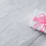 top view gift box with pink ribbon white marble crc171e8615 size4.22mb 5971x2745 - title:Home - اورچین فایل - format: - sku: - keywords:وکتور,موکاپ,افکت متنی,پروژه افترافکت p_id:63922