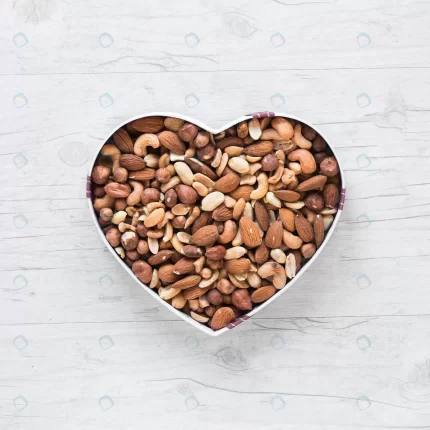 top view healthy dryfruits heart shape wooden des crcaa03eda6 size5.51mb 3501x3501 - title:graphic home - اورچین فایل - format: - sku: - keywords: p_id:353984