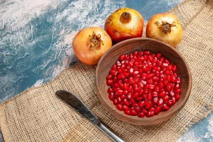 top view pomegranate seeds wooden bowl dinner kni crcc2e2d514 size16.97mb 5600x3733 - title:graphic home - اورچین فایل - format: - sku: - keywords: p_id:353984