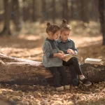 two little girls reading books woods crc41bf3dbc size13.12mb 7952x5304 - title:Home - اورچین فایل - format: - sku: - keywords:وکتور,موکاپ,افکت متنی,پروژه افترافکت p_id:63922
