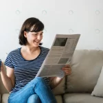 - woman reading newspaper rnd139 frp3640638 - Home