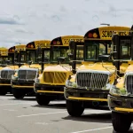 - yellow school buses parked near high school rnd712 frp17279441 - Home