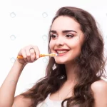 - young woman with great teeth holding tooth brush crcb15ca86e size6.79mb 5472x3648 - Home