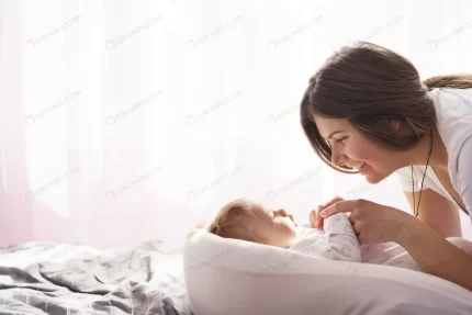 mother with her newborn son lay bed rays sunlight crce7f037df size6.61mb 6000x4000 - title:graphic home - اورچین فایل - format: - sku: - keywords: p_id:353984