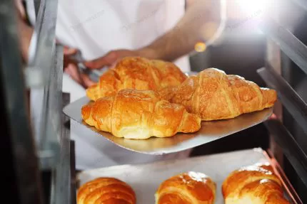 baker holding tray with freshly baked french croi crc720da925 size8.48mb 6000x4000 - title:Home - اورچین فایل - format: - sku: - keywords:وکتور,موکاپ,افکت متنی,پروژه افترافکت p_id:63922